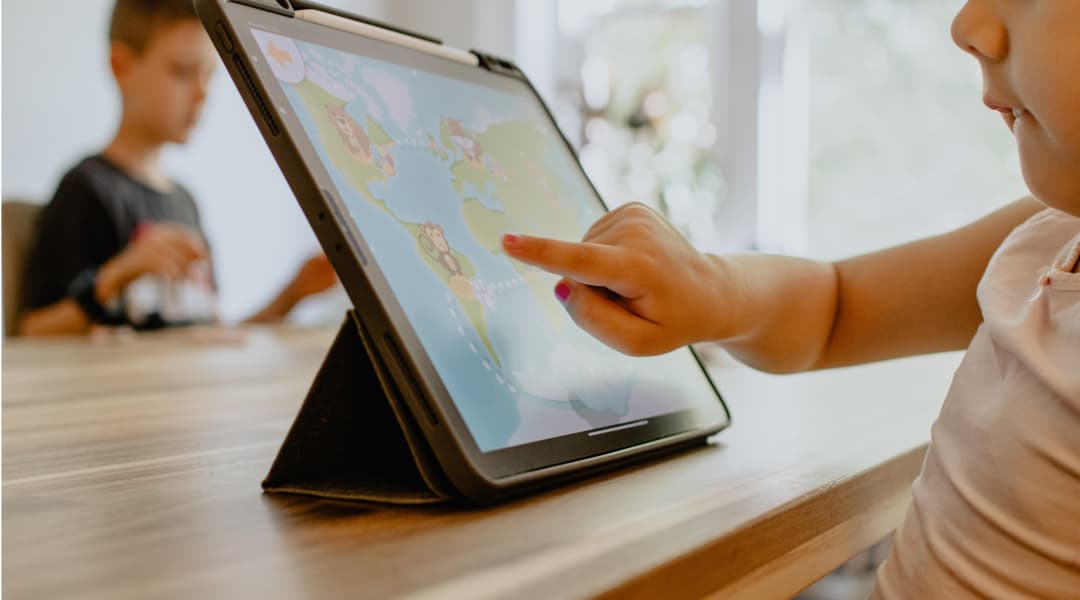 child learning on tablet